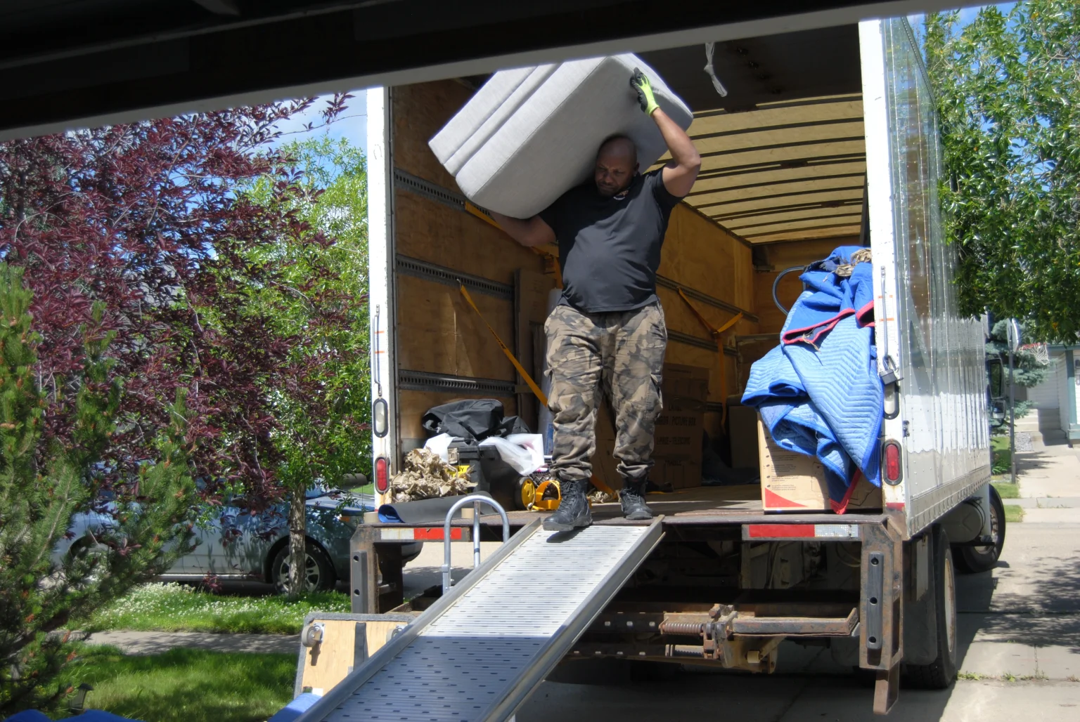 Burly Boyz cross Canada moving company team preparing furniture for a safe long-distance relocation.